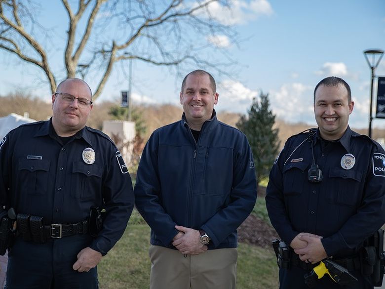 Three police officers standing